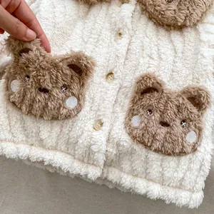 Kids warm fleece pajama set with cute brown bear pockets and soft white plush texture