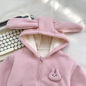 Detail of pink fleece hoodie with 3D bunny ears and soft warm lamb wool lining
