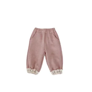 Girls dusty pink thermal fleece trousers with ribbed texture and lace trim cuffs