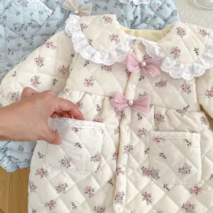 Quilted floral baby bodysuit with lace collar and pink bows for infant girls