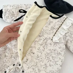 Quilted floral baby romper with warm fleece lining and elegant lace trim detail