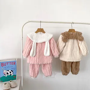 Detail view of thick winter fleece pajama sets with rabbit ears and warm plush material