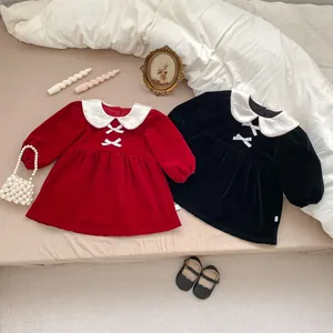 Detail of girls velvet princess dress featuring a large Peter Pan collar and white bowknot
