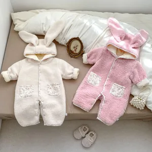 Fleece baby romper with floral bunny ears and warm floral pockets in pink and off-white