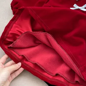 Red velvet girls princess dress with bow detail and warm fleece lining for winter wear