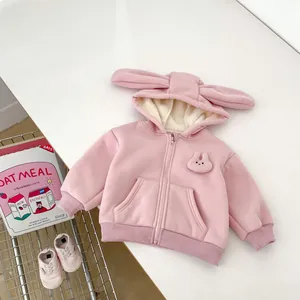 Detailed view of pink fleece hoodie for girls featuring cute bunny ears and soft lining