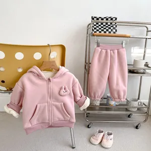 Detail of pink fleece hooded jacket with cute rabbit patch and warm lamb wool lining