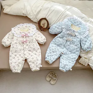 Floral quilted baby romper with lace collar and bow detailing in sweet retro style