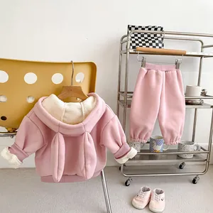 Detail of pink fleece hooded toddler tracksuit with cute rabbit ears on the hood