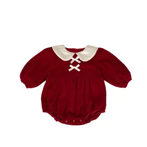 Infant winter red velvet romper with Peter Pan collar and bow for holiday celebrations