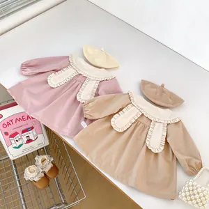 Detailed flat lay of toddler girl lace collar dress set with matching beret hat