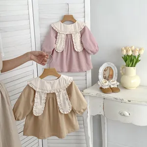 Close-up of baby girl jacket with large ruffle collar and cute long rabbit ear details
