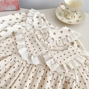 Floral and polka dot baby bodysuits with lace Peter Pan collars in waffle cotton