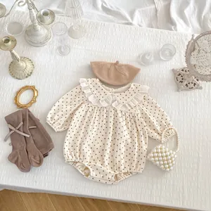 Detail view of floral baby romper with elegant lace collar and matching beret set