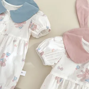 Detail of baby rompers with bear prints, peter pan collars and cute bunny ears
