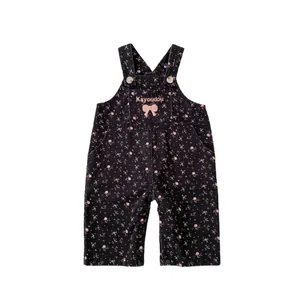 Peto para bebé niña en azul marino con estampado floral y bordado de lazo rosa