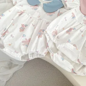 Detail of baby summer cotton romper with Peter Pan collar and cute bear print