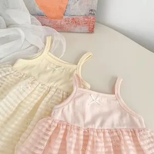 Detailed view of baby girl summer tutu dresses with lace bows and ribbed knit texture