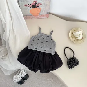 Girls summer fashion set with grey bow print camisole top and black puff shorts