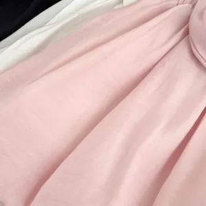 Stack of baby girls bloomers fabric in pink, white, and black with bow detail
