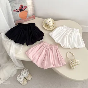 Sweet toddler girl bow bloomer shorts in black, pink, and white cotton summer set