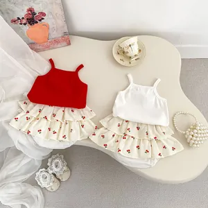 Detail of baby girl summer cherry print tiered cake skirt and camisole strap top set