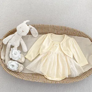 Detail view of baby girl summer mesh tutu dress with yellow knit cardigan in a gift basket