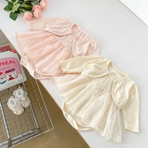 Detail of baby girl rib-knit bodysuit with checkered mesh tutu and matching cardigan