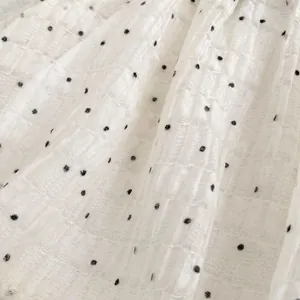 Toddler girl summer two-piece set featuring white polka dot bubbled texture fabric