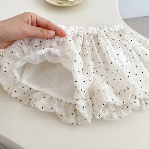 Detail view of baby polka dot bloomer shorts with seersucker fabric and soft cotton lining