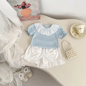 Toddler girl summer set with blue waffle knit top, lace collar and heart pocket shorts