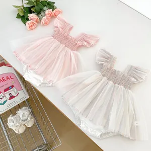 Detail of pink and macaron striped baby tulle rompers with layered mesh and ruffles