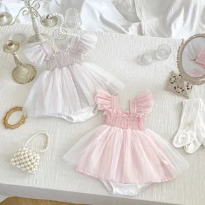 Detail view of two baby girl tulle rompers with flutter sleeves and striped patterns