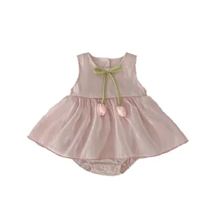 Pink sleeveless baby bodysuit dress with green bow and tulip charms for toddlers