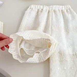 Girls' white summer outfit featuring breathable embroidered top and wide-leg pants