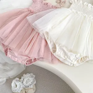 Detail of baby tutu romper with tiered mesh skirt and snap closures on crotch