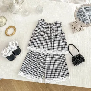 Summer kids set with black gingham sleeveless top, wide leg shorts and lace trim