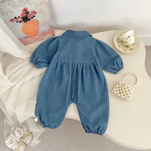 Detail of baby denim romper featuring lapel collar and elastic cuffs in a retro setting