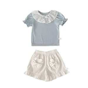 Cute girls summer set with blue lace collar top and white heart pocket shorts