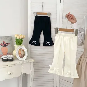 Pantalon évasé fille avec nœud en noir et crème, style décontracté pour le printemps