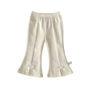 Pantalon évasé en maille blanc crème pour fillettes avec nœuds et fentes aux chevilles