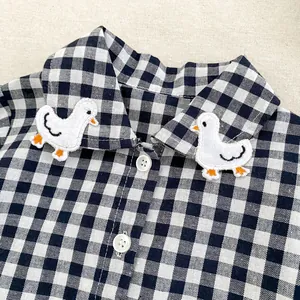 Infant boys' long sleeve gingham plaid shirt featuring cute embroidered white duck accents