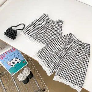Girls black and white plaid two-piece set with sleeveless lace top and wide-leg shorts