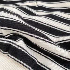 Classic black and white striped long sleeve knit top for boys made of soft cotton fabric