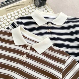 Close-up of striped knit polo shirts with contrast collars and textured fabric detail