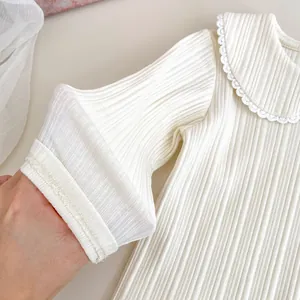White ribbed long sleeve baby shirt with lace Peter Pan collar and soft cotton fabric