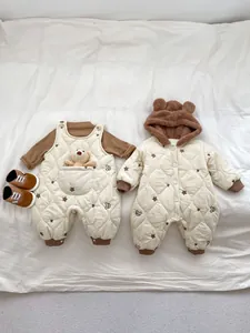 Close-up of quilted winter baby rompers with cute bear ears and plush warm lining