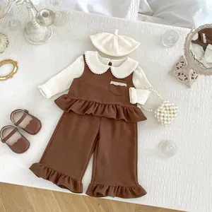Three-piece girls autumn set with brown ruffle bib pants and beige lace collar shirt