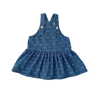Girls denim overall dress with heart bow print and ruffled hem, two-piece style