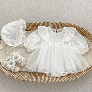 Detail of baby girl white lace tutu romper set with matching bonnet and shoes for events